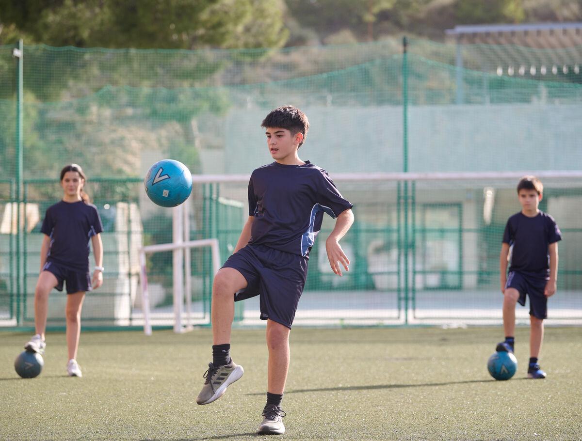KC Alicante Student Playing Football