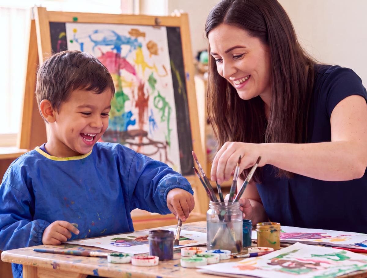 Student painting with watercolours during a Creative optional activity at King's College, Alicante