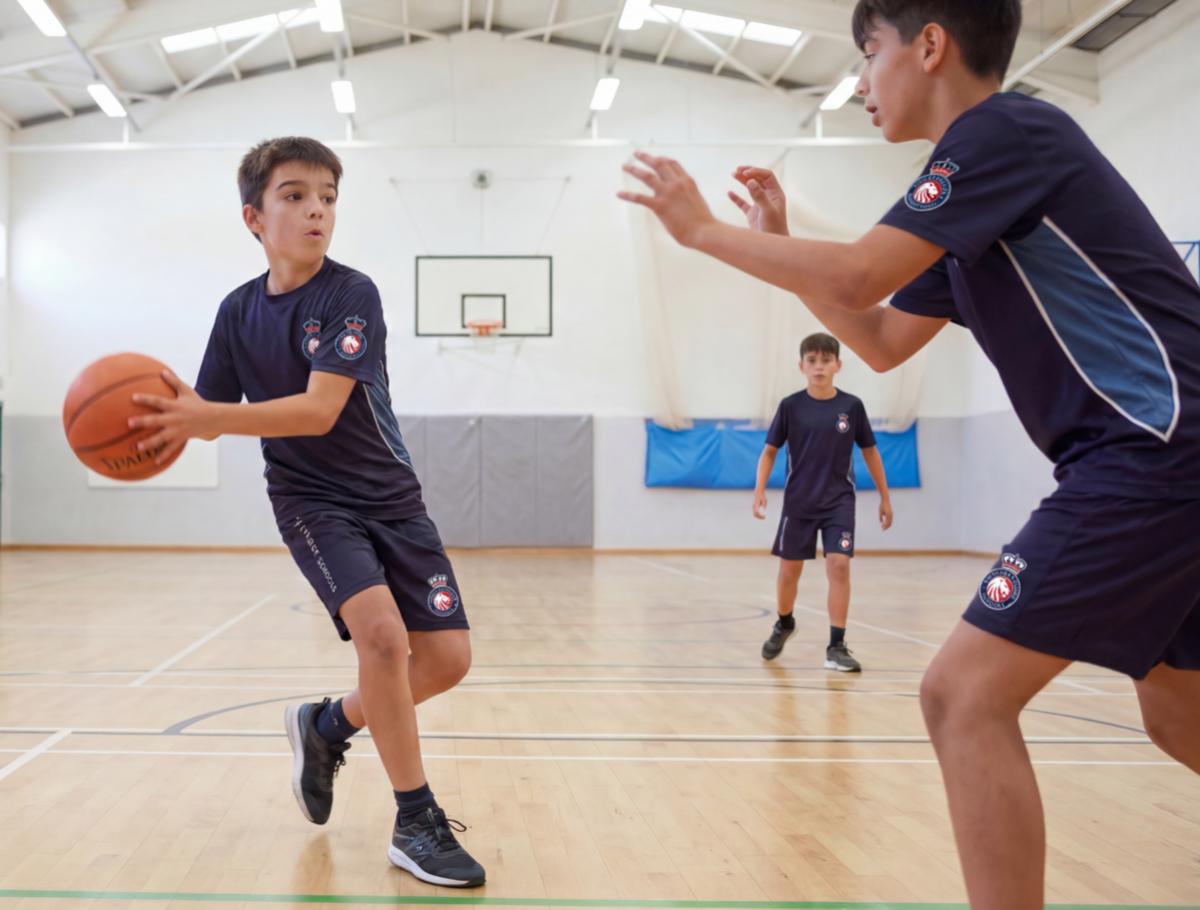 Students playing badminton during a Sport optional activity at King's College, Alicante